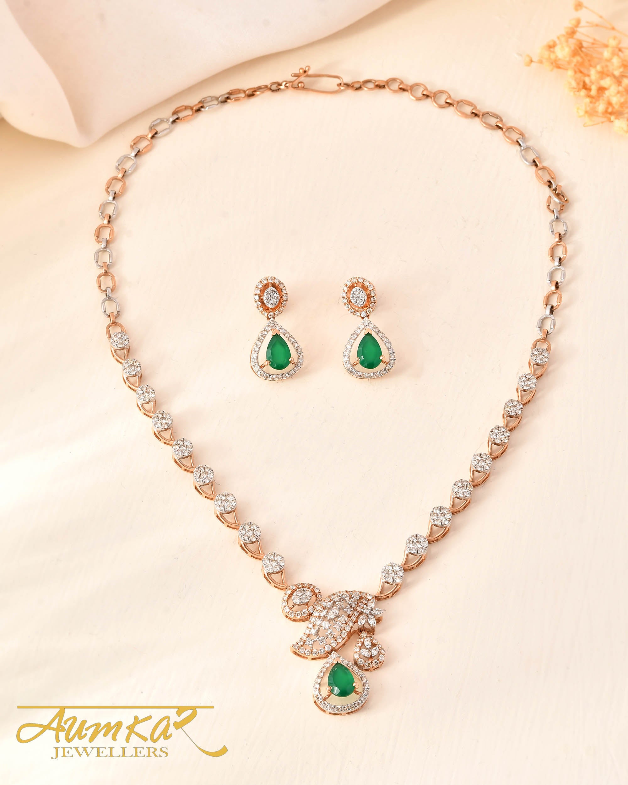 Green Grace: Pressure-Set Round Diamond Necklace Set With Radiant Green Gems