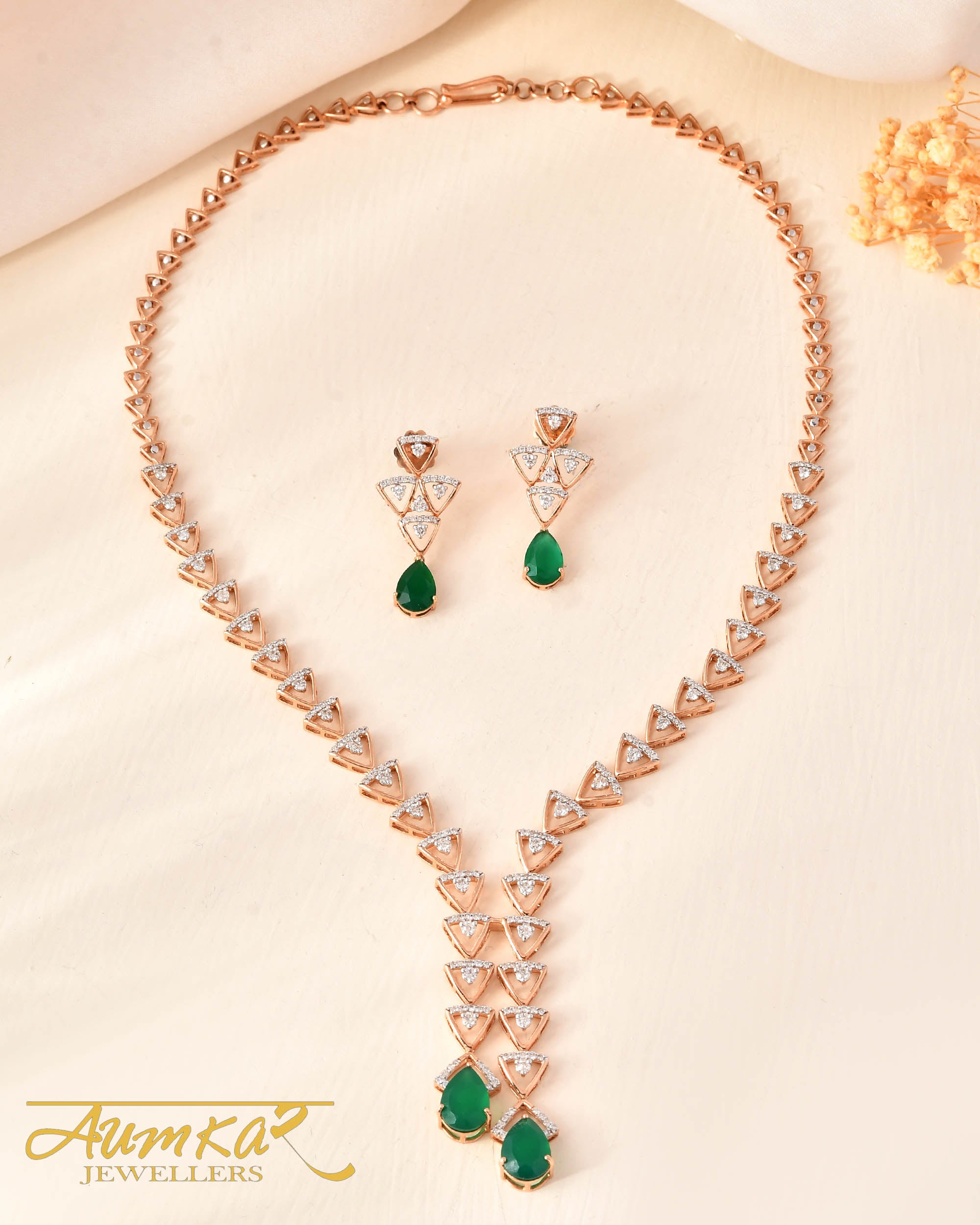 Gleaming Green: String Designer Necklace With Round Diamonds And Exquisite Green Stones